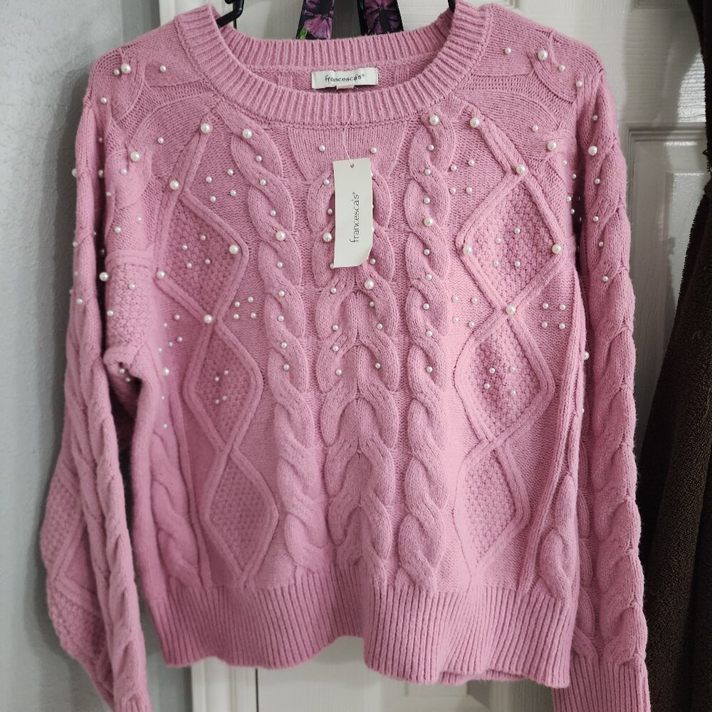 Francesca's pink sweater
